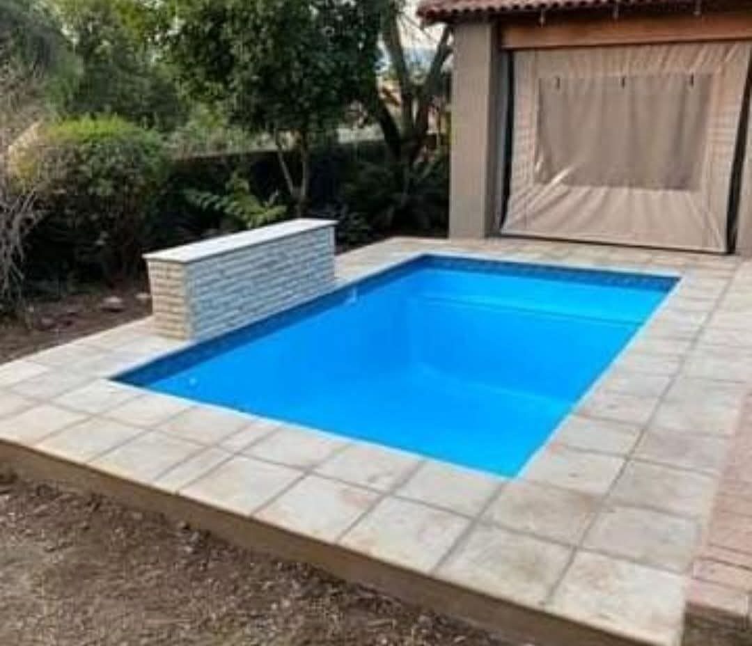 Finished rectangular pool with feature wall