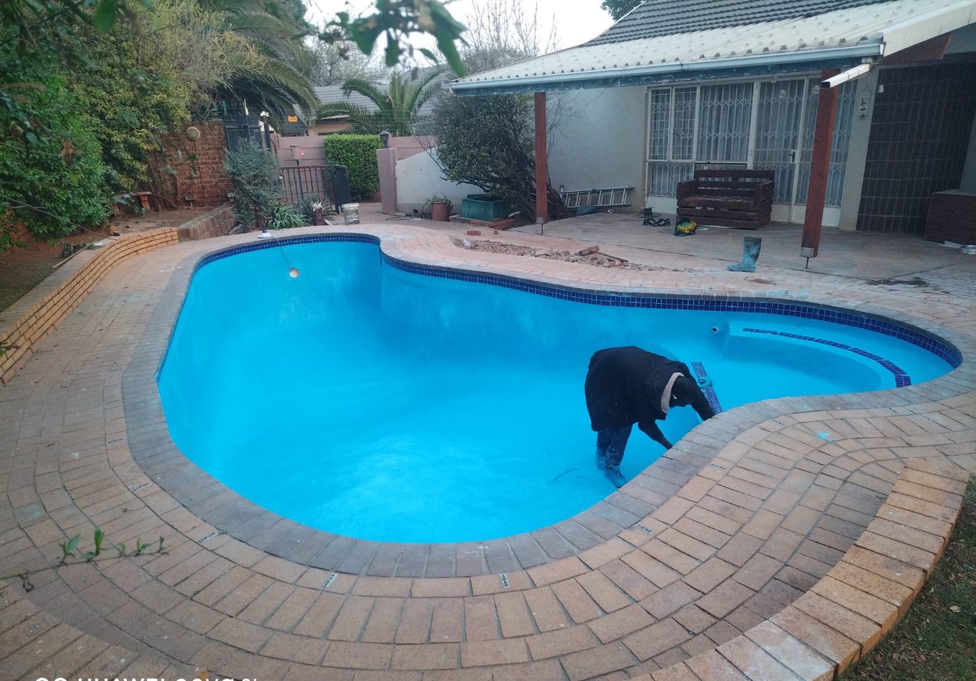 Bright blue freeform pool