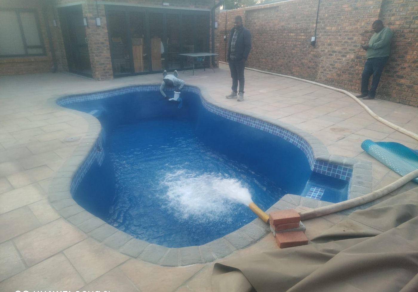 Freeform pool resurfaced deep blue