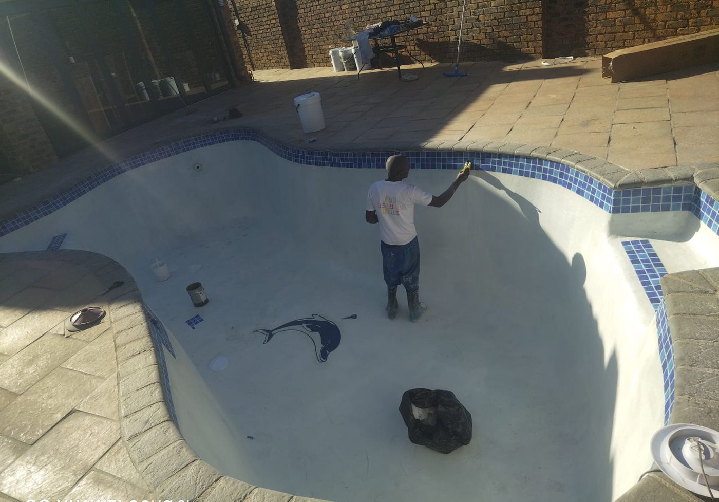 Pool being resurfaced with fresh marbelite